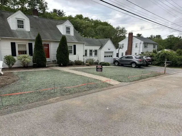 Hydroseeded lawn along a driveway